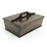 An 18thC dark patinated and hinge lidded mahogany cutlery box with central handle flanked by two