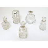 5 assorted glass scent bottles, some with silver mounts.