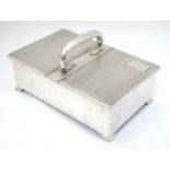 An Art Deco silver table top cigarette box with engine turned decoration,