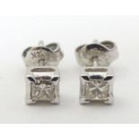 A pair 18ct white gold diamond solitaire earrings. Each diamond 0.