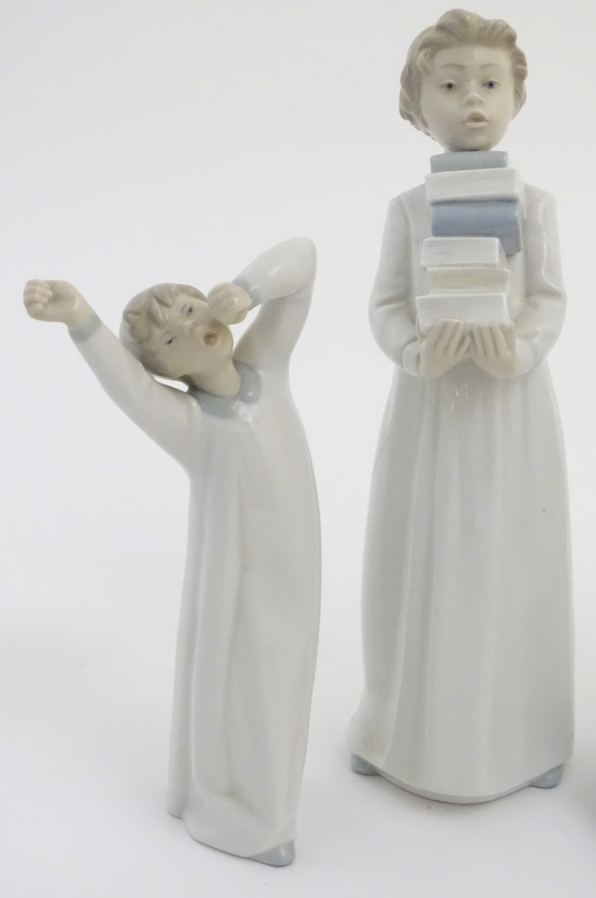 Four Nao figures to include 'Boy with Slippers', model no. 232, 'Boy with Books', model no. - Image 3 of 12