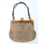 A ladies handbag/purse with an amber coloured celluloid frame,