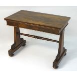 A mid 19thC rosewood Gillows style library table with tapering acanthus scrolled supports united by