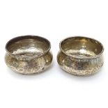 A pair of Art Deco silver salts with hammered decoration hallmarked Birmingham 1923 maker Albert