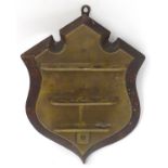 An early 20thC shield-shaped pipe rack,