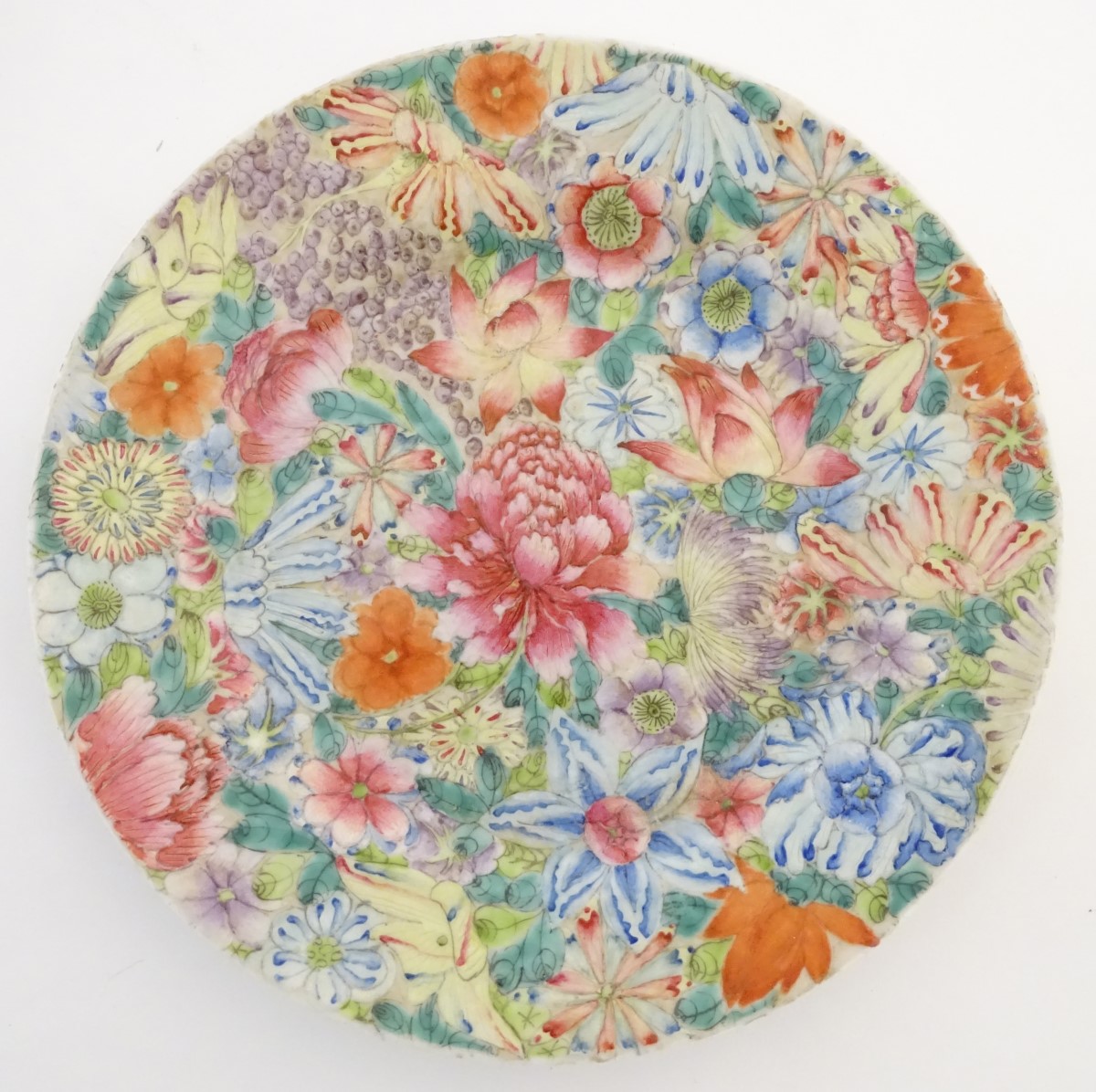 An Oriental plate decorated with stylised flowers, with a scrolling floral design to reverse. - Image 3 of 11