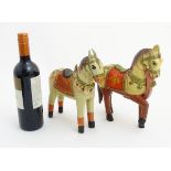 2 carved wooden and painted Indian ? tacked horses, one with a decorative martingale ,
