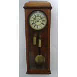 An early XX Vienna wall clock: an 8 day, oak cased clock with 2 weights, striking on a gong,