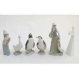 A quantity of Lladro and Nao figures, to include two Lladro penguins and girl holding a chicken,