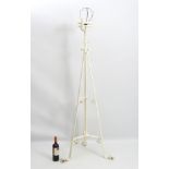 Arts and Crafts : a white painted late 19thC tripod formerly telescopic floor standing oil lamp