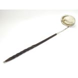 A 19thC punch / toddy ladle with twist handle and white metal mounts and bowl.