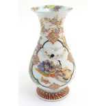 A Japanese baluster vase with a flared foot and rim,