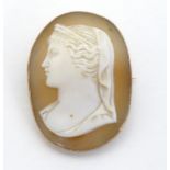 A Victorian shell carved cameo brooch depicting a classical lady in side profile within a 9ct gold
