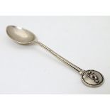 Lawn Bowls Interest : A silver teaspoon with image to handle depicting a bowls player.