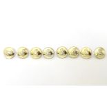Militaria: a set of eight tunic buttons by Gaunt, London,