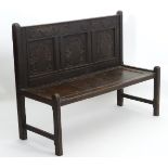 An 18thC and later oak Wainscot style bench,
