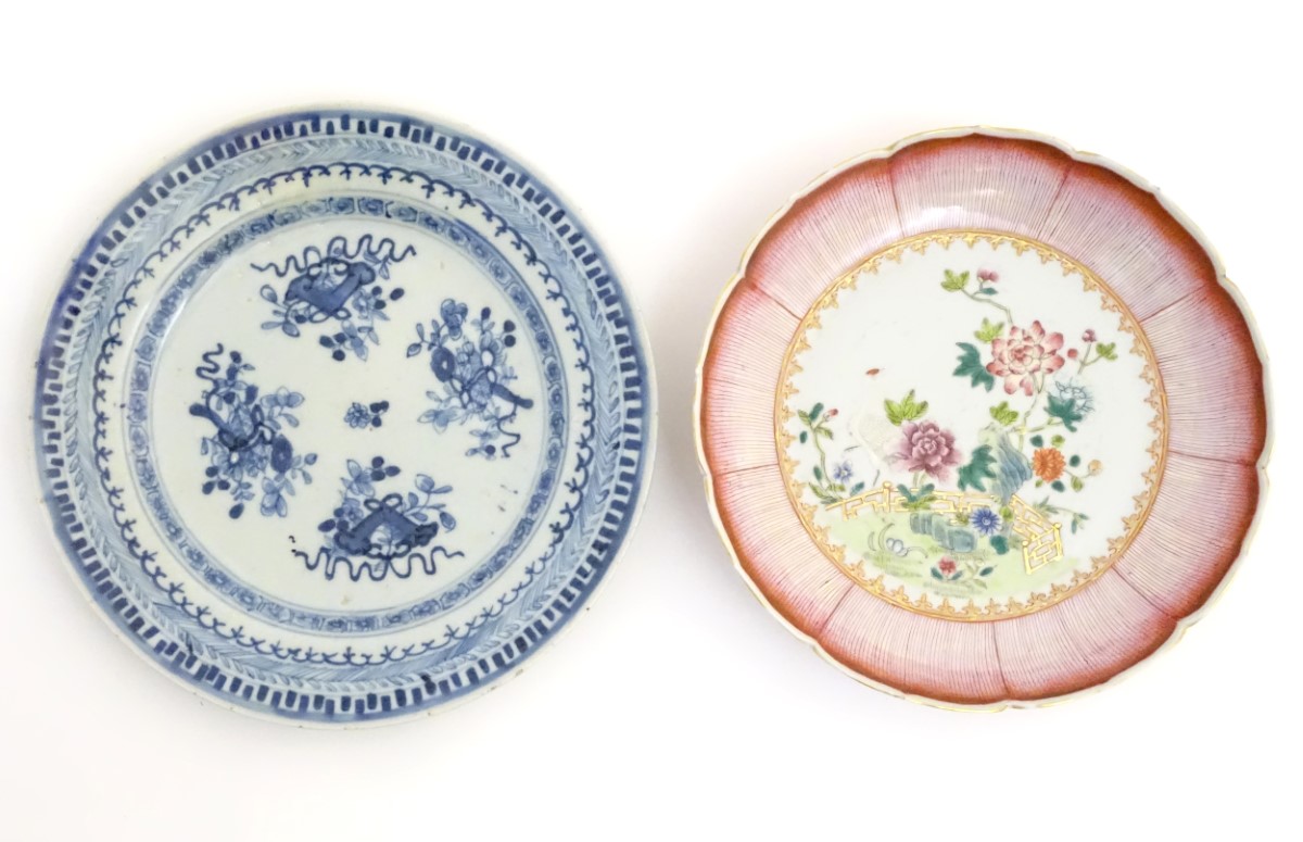 An 18thC Chinese blue and white plate decorated with Daoist emblems, and banded patterned borders.