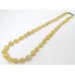 A Vintage necklace of graduated hardstone quartz beads 24” long CONDITION: Please