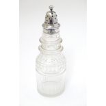 A cut glass pepperette with silver top hallmarked London 1864 maker George John Richards & Edward