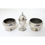 A silver plate pepperette together with a pair of salts.