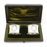 A cased pair of silver napkin rings hallmarked Birmingham 1914 maker Gorham Manufacturing Co.