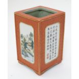 A 20thC Chinese brush pot of rectangular form, decorated with four panels with gilt highlights,
