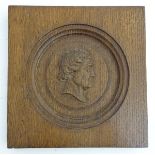 An 18th / 19thC Grand Tour oak panel with a roundel with a relief profile head to centre,