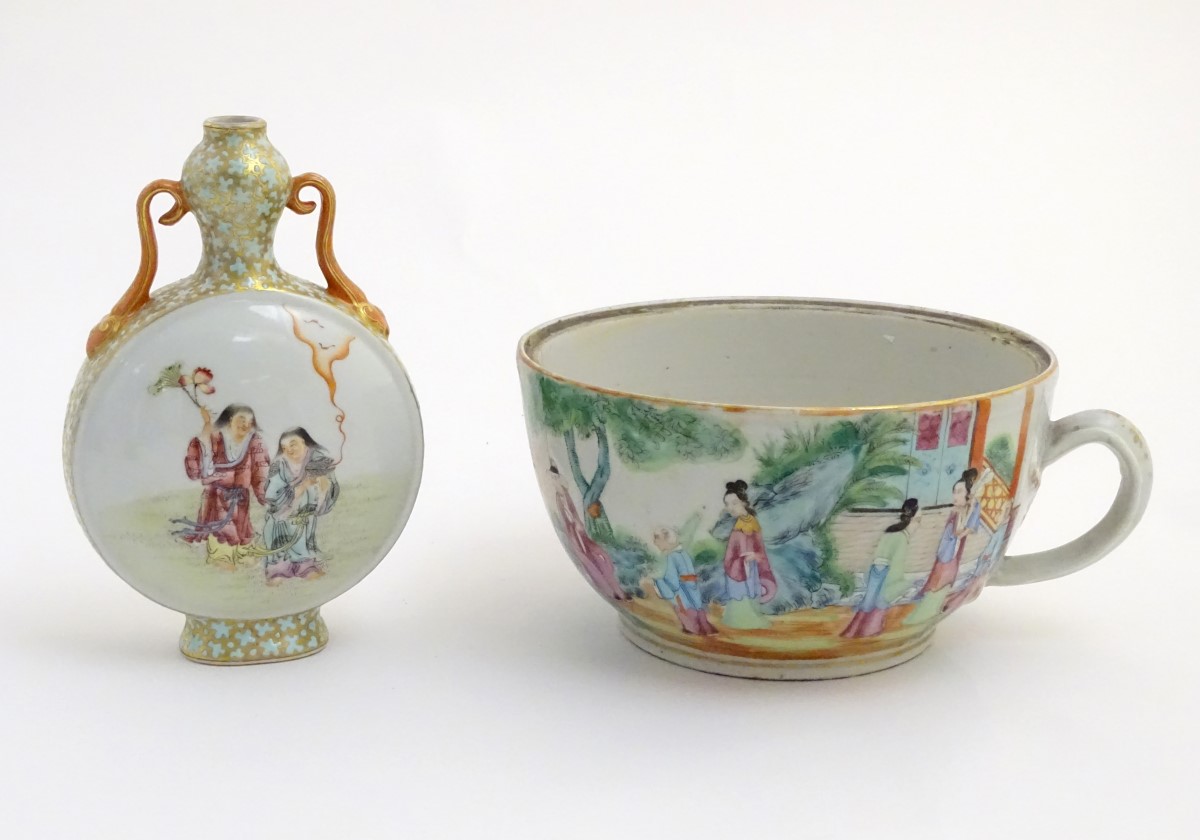 A Chinese twin handled moon vase decorated on one side with a lady and a frog,