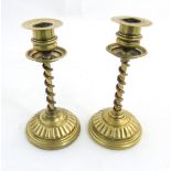 Arts and Crafts copper and brass candlesticks, the shafts with copper twist decoration.