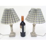 Table Lamps: a pair of silver plate electric lamps formed as Corinthian column candle sticks with