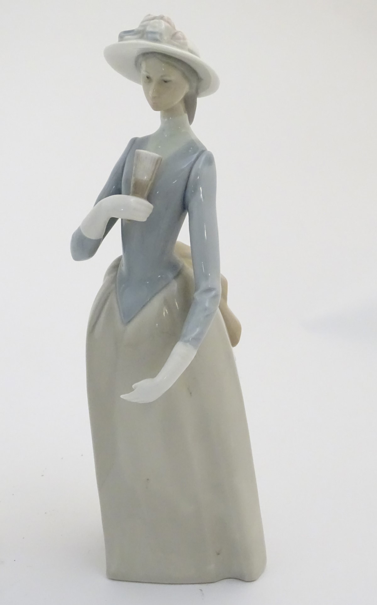 Four Nao figures to include 'Boy with Slippers', model no. 232, 'Boy with Books', model no. - Image 5 of 12