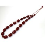 A vintage necklace of graduated cherry amber coloured beads.