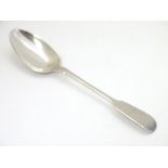 A silver fiddle pattern teaspoon hallmarked London 1828 maker Clement Cheese.