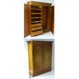 A large Victorian mahogany wardrobe with a large moulded cornice above two paneled doors,