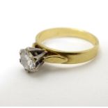 An 18ct gold diamond solitaire ring. the diamond approx 0.