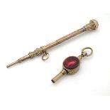 A 19thC gilt metal pocket watch key 1/2" long set with central seal section together with a gilt