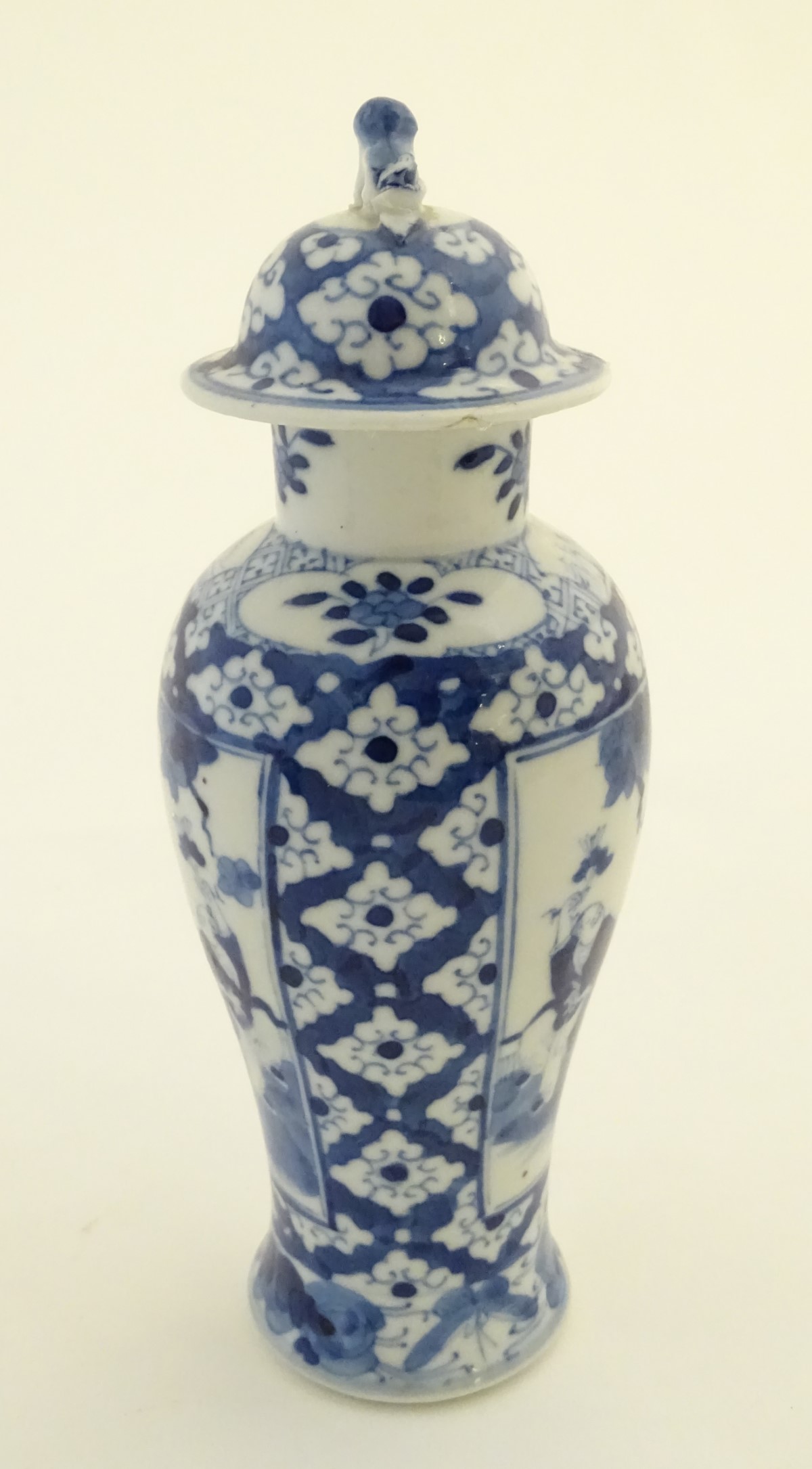 A Chinese blue and white ginger jar decorated with a floral pattern and two panels depicting an - Image 6 of 7