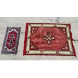 Rug / Carpet : two assorted rugs , one a small rug with red ground , blues , greens , browns ,