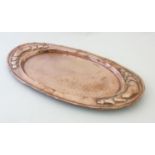 Art and Crafts Decorative metalware : An embossed and plannished large oval butlers tray with heart
