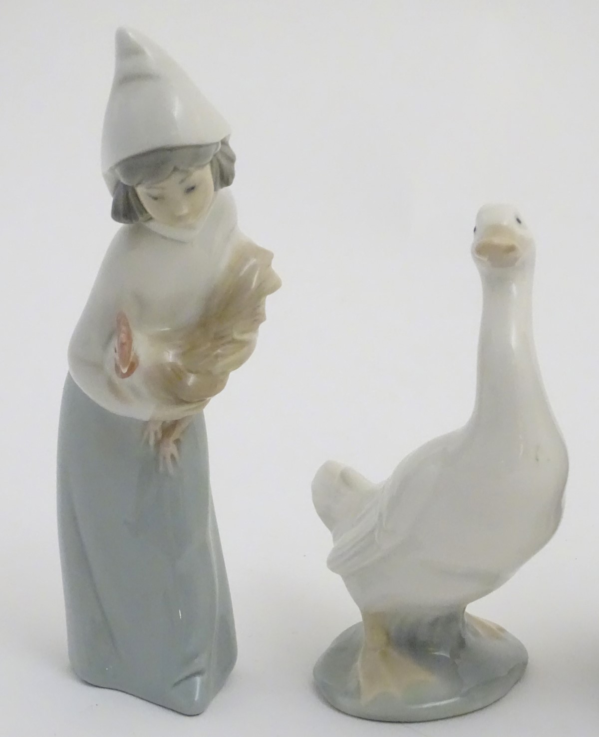 A quantity of Lladro and Nao figures, to include two Lladro penguins and girl holding a chicken, - Image 3 of 11