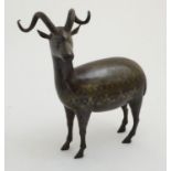 A late 19thC Indo - Persian gold inlaid steel figure of a deer,
