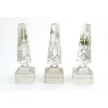 Glass prisms / obelisks : Three Victorian glass triangular prisms on square bases with hand