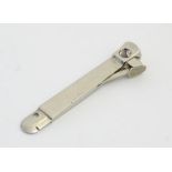 A 20thC stainless steel cigar cutter,