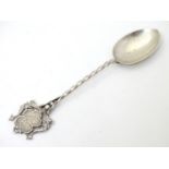 A silver souvenir spoon with crest to handle titled Ilfracombe.