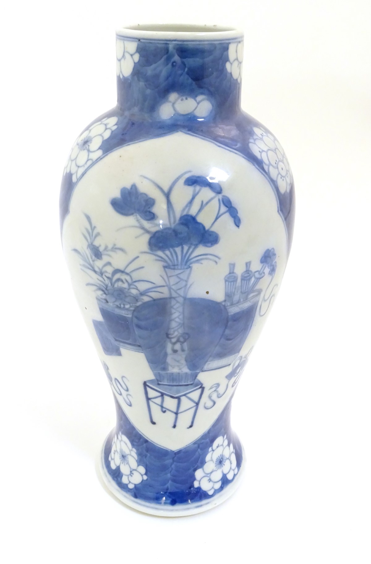 A Chinese, blue and white baluster vase decorated with prunus flowers, - Image 9 of 12