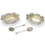 A pair of silver salts hallmarked Chester 1900 together with a pair of salt spoons hallmarked 1901