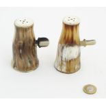 A pair of cow horn pepperettes with side action handles, for table salt and pepper, 4” high.
