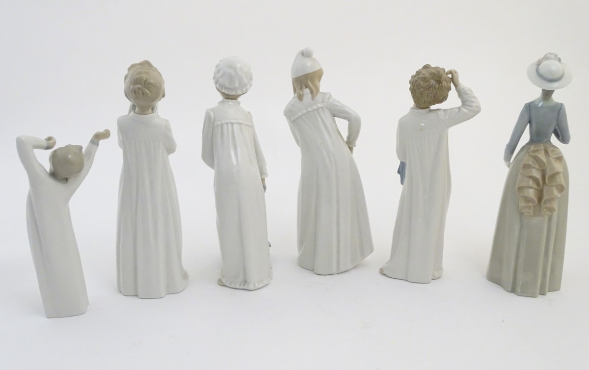 Four Nao figures to include 'Boy with Slippers', model no. 232, 'Boy with Books', model no. - Image 6 of 12