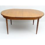 Vintage Retro : a British G-Plan ( red ) teak extending table designed by Victor Bramwell Wilkins