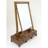 A mid 20thC Cotswold school toilet mirror,